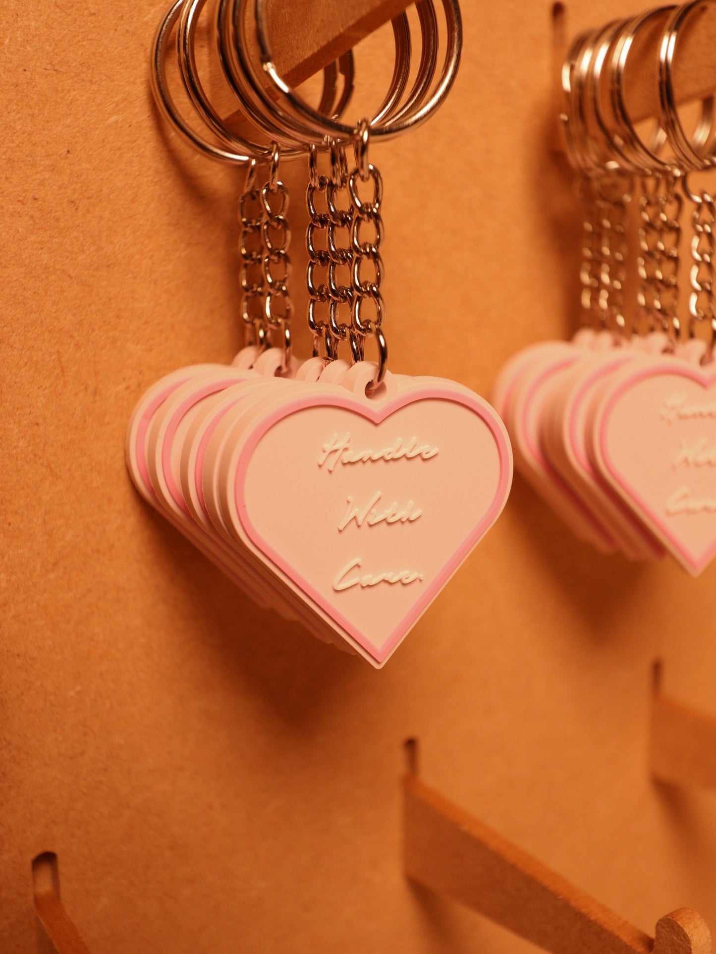 HANDLE WITH CARE KEYRINGS.